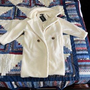 Women’s knee length cream coat